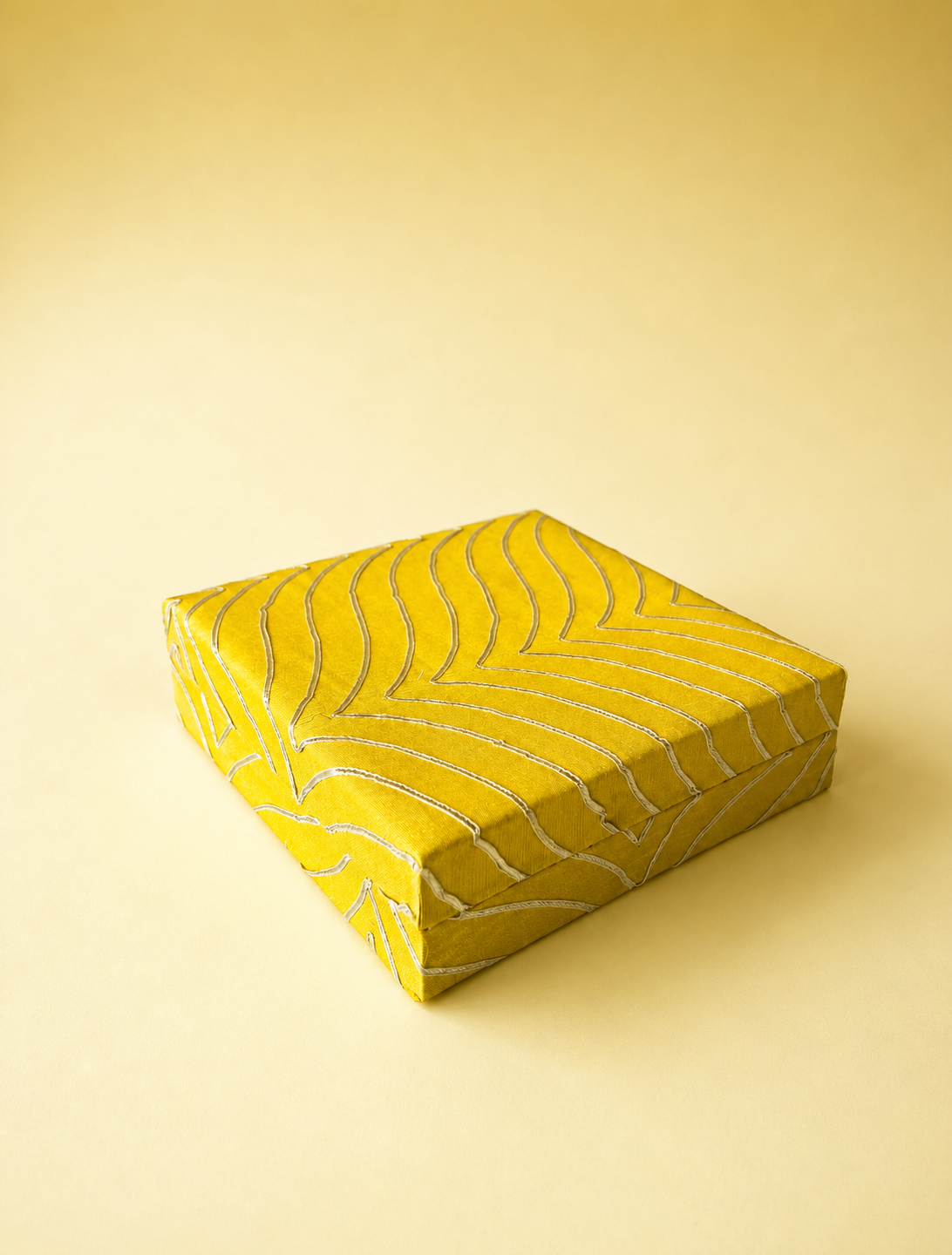 A yellow and gold half-kilogram mithai box with traditional gota detailing, designed for presenting sweets, dry fruits, and confectionery for weddings, festivals, and festive gifting.