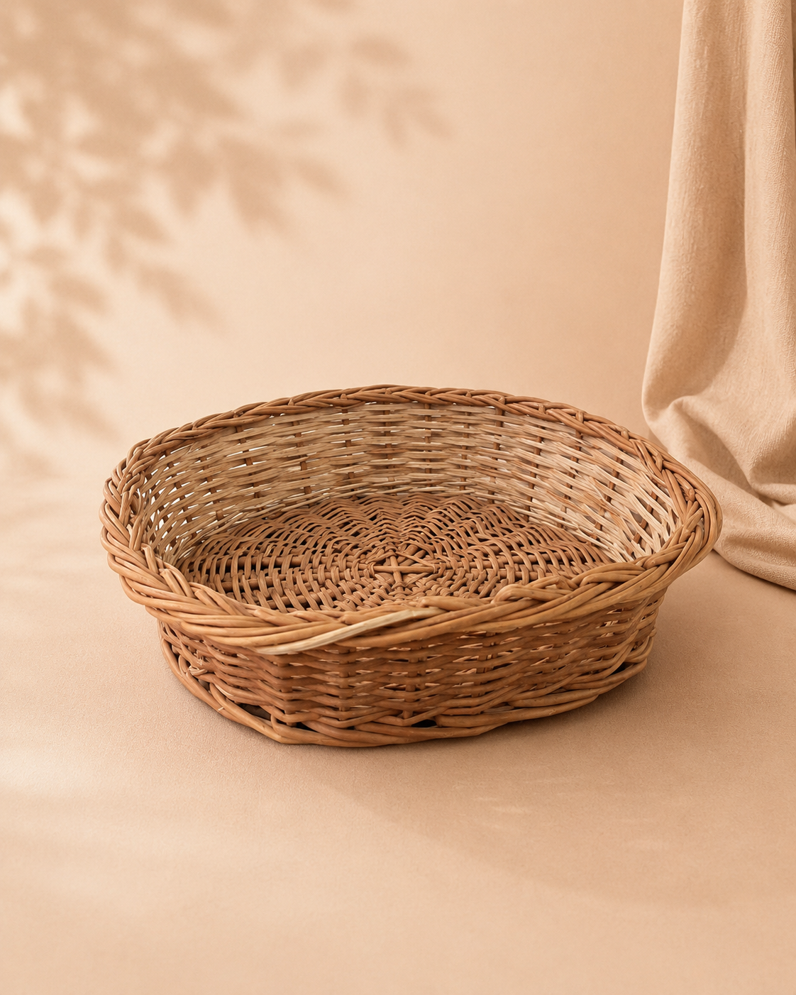 A square cane hamper basket with a natural woven finish, designed for arranging sweets, dry fruits, chocolates, flowers, and curated festive gifts.