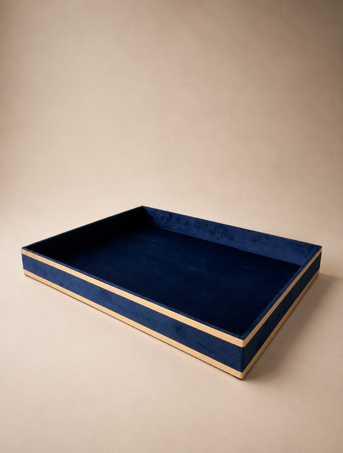 A deep blue suede gift tray with a soft textured surface and contrasting golden trim, suitable for jewellery, sweets, dry fruits, candles, and premium gift arrangements.