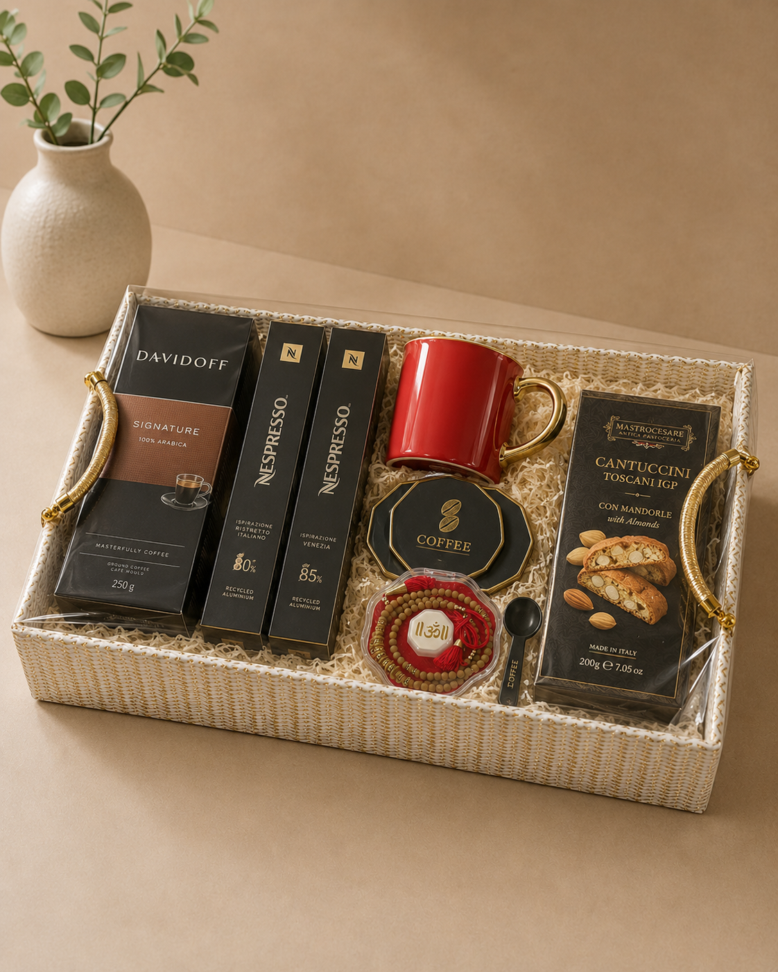 A premium woven gift tray featuring Davidoff coffee, Nespresso coffee sleeves, a red coffee mug, biscotti, a Rakhi, coffee accessories, and elegant festive styling for Raksha Bandhan gifting.