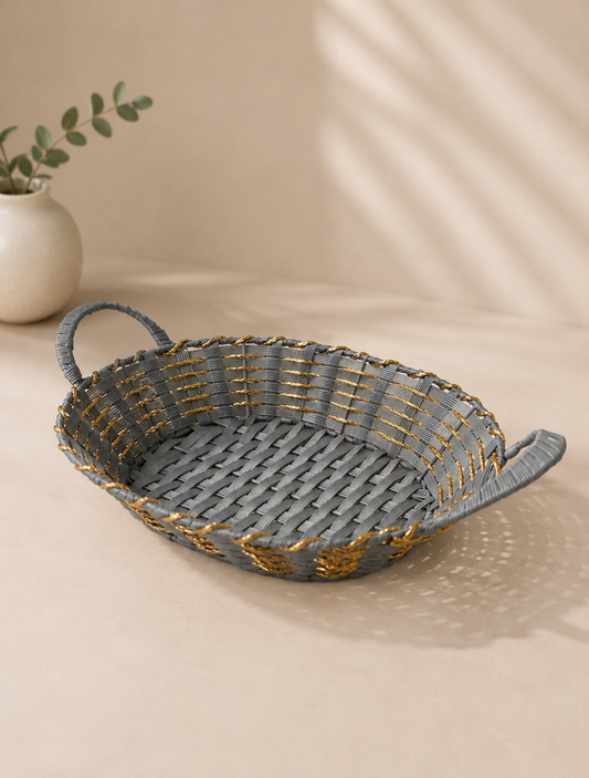 A grey and golden wicker basket with a wide shallow shape and side handles, suitable for festive hampers, flowers, chocolates, dry fruits, and curated gifts.