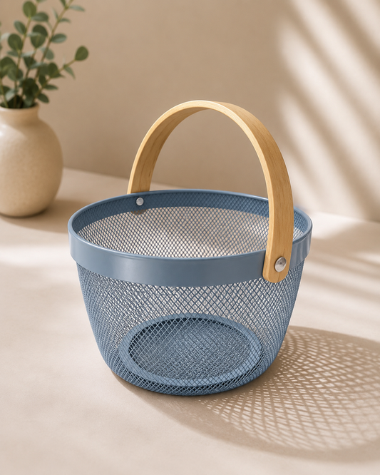 A blue round metal gift basket with a perforated texture and curved wooden-style handle, suitable for chocolates, dry fruits, flowers, candles, and small gift hampers.