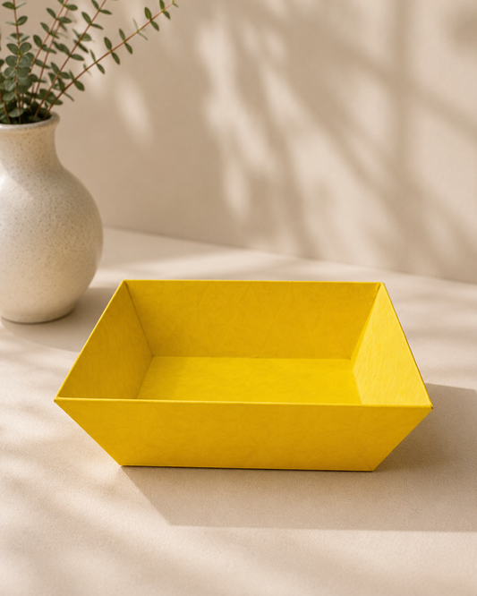 A bright yellow open-top cardboard tray designed for arranging sweets, chocolates, dry fruits, and small products in festive gift hampers and return gifts.