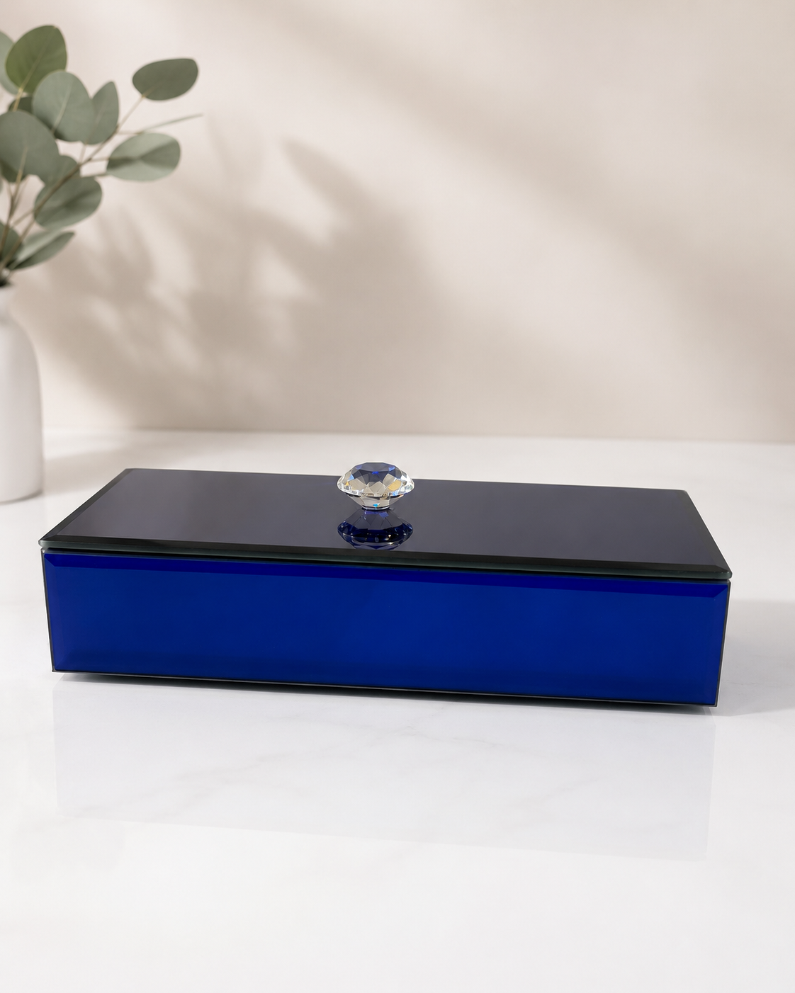 A large blue glass gift box with an elongated rectangular shape, glossy finish, and decorative knob, suitable for jewellery, chocolates, candles, keepsakes, and premium gift assortments.