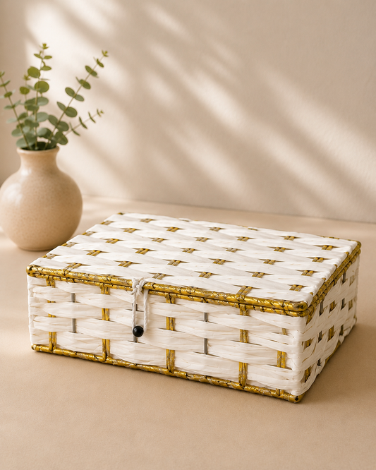 A white and golden woven trunk hamper box with a checkered pattern and decorative golden detailing, suitable for sweets, dry fruits, chocolates, jewellery, and festive gifting.