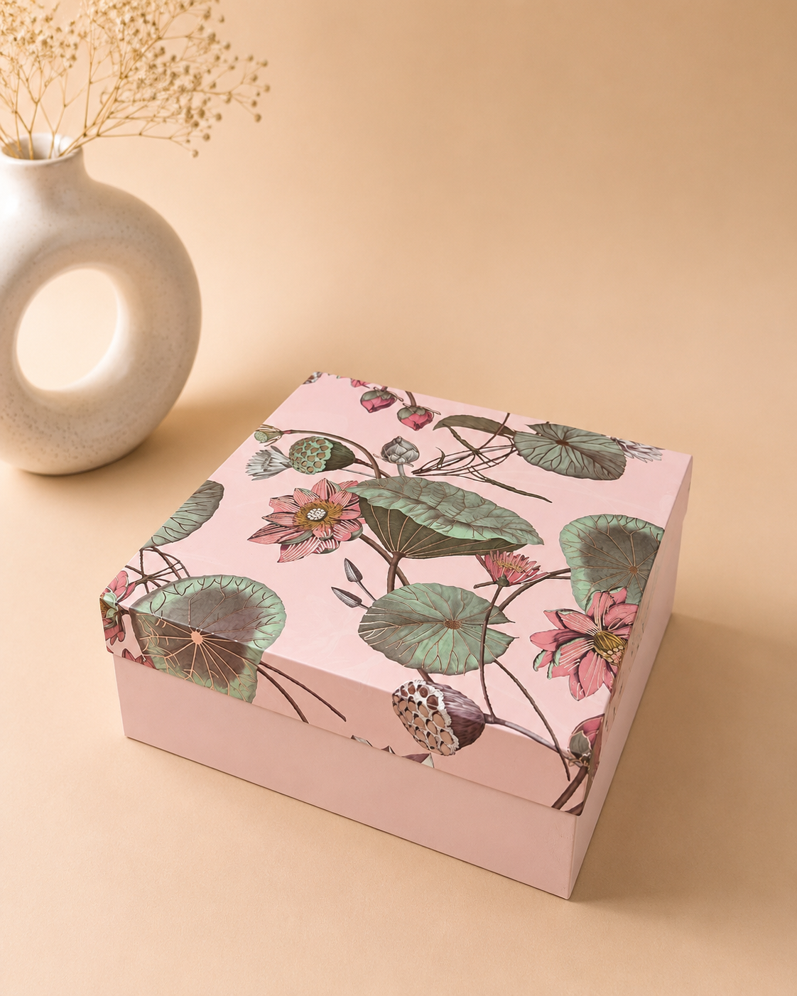 A pink 12x12 kappa gift box with a botanical floral printed lid and square shape, suitable for larger gift assortments, chocolates, dry fruits, beauty products, and festive hampers.