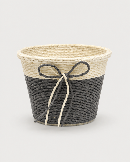 A small grey and natural woven gift basket with a decorative bow, ideal for wellness hampers, chocolates, corporate gifts, and elegant festive gift presentations.
