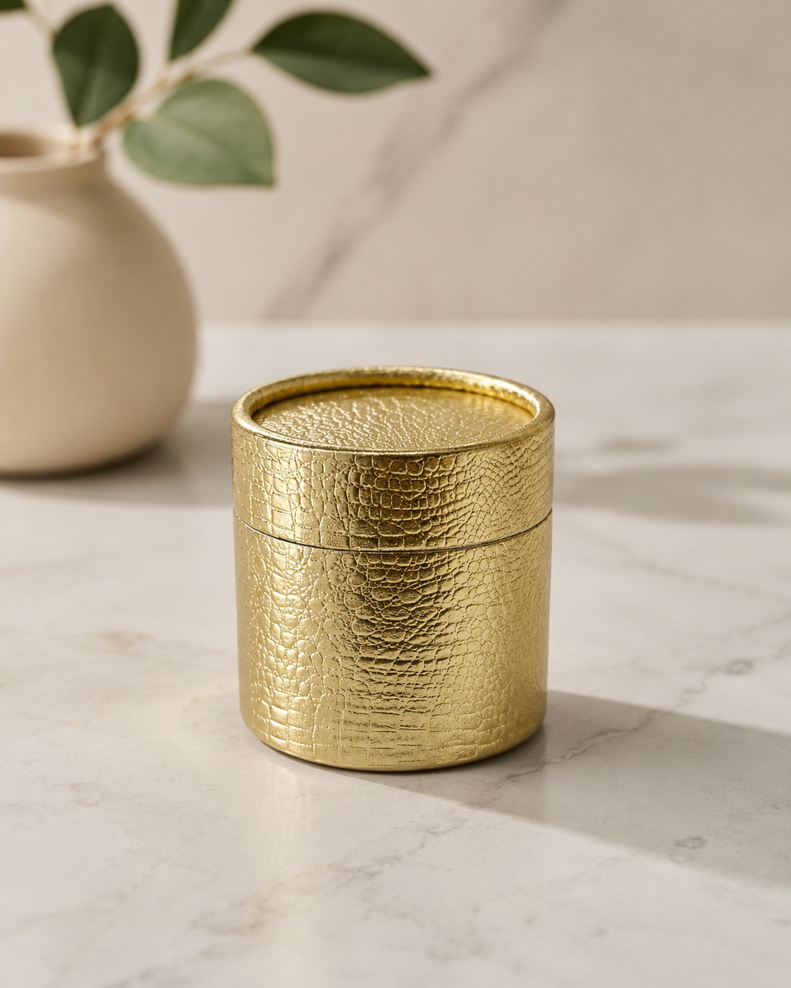 A textured golden metal barrel gift box with a matching lid, designed for premium gifting, chocolates, dry fruits, candles, and decorative keepsakes.