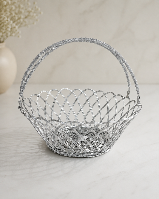 A silver flower-shaped wire tokra with an open woven design and arched handle, suitable for flowers, sweets, dry fruits, festive gifts, and return favours.