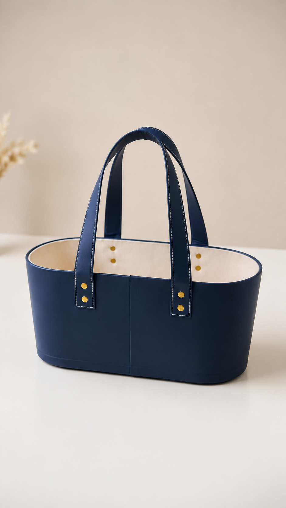 A deep blue soft fabric basket bag with cream lining, matching handles, and a structured open design, suitable for clothing, beauty products, accessories, festive hampers, and corporate gifts.