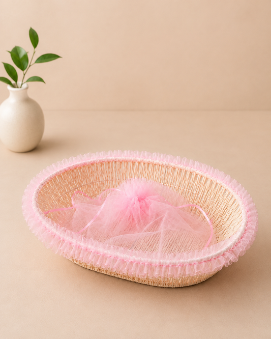 A shallow pink net tokri with a delicate woven texture, suitable for baby shower favours, bridal shower gifts, flowers, chocolates, sweets, and small hampers.