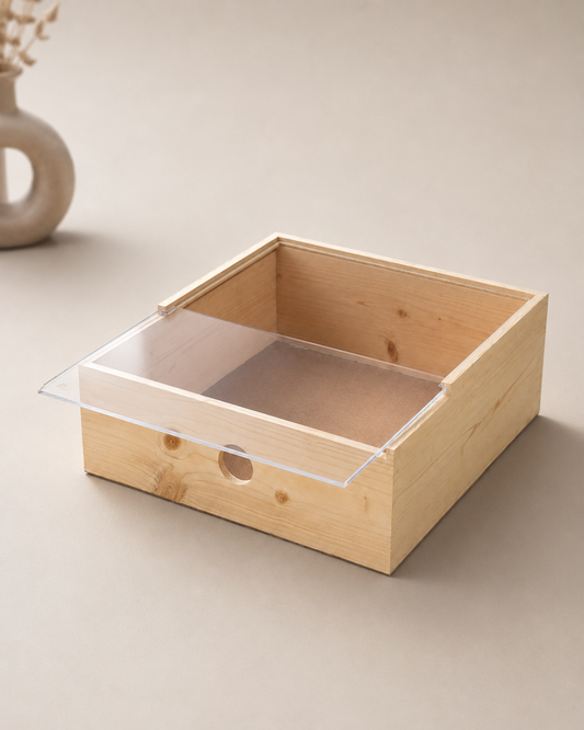 A large premium gift box with a natural pinewood base and a clear acrylic lid, designed for elegant hampers, corporate gifts, festive assortments, and curated product displays.