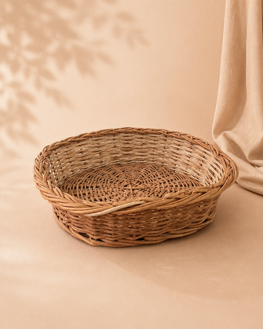 A square cane hamper basket with a natural woven finish, designed for arranging sweets, dry fruits, chocolates, flowers, and curated festive gifts.
