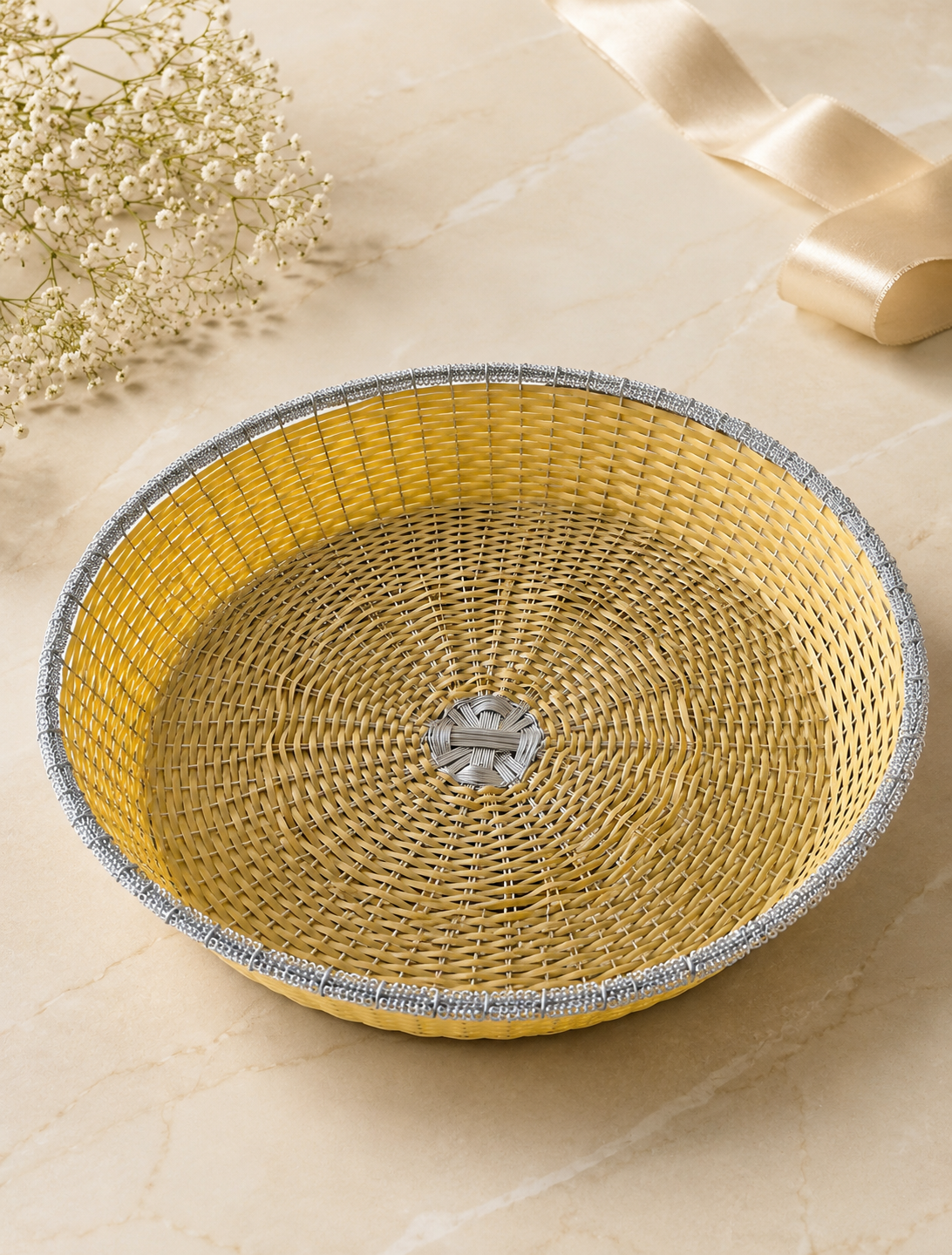 A round woven tokra with a golden interior and contrasting silver rim, designed for presenting sweets, dry fruits, flowers, and festive gift arrangements.