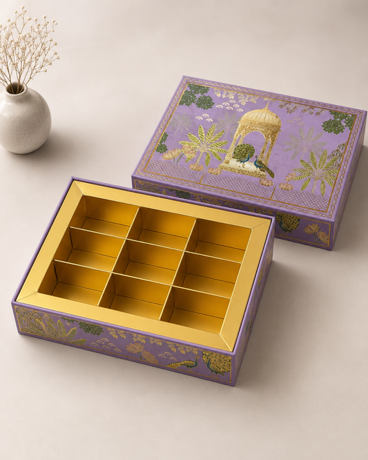 A purple floral printed cavity gift box with a golden interior and multiple compartments, suitable for chocolates, sweets, dry fruits, assorted treats, and festive gifting.